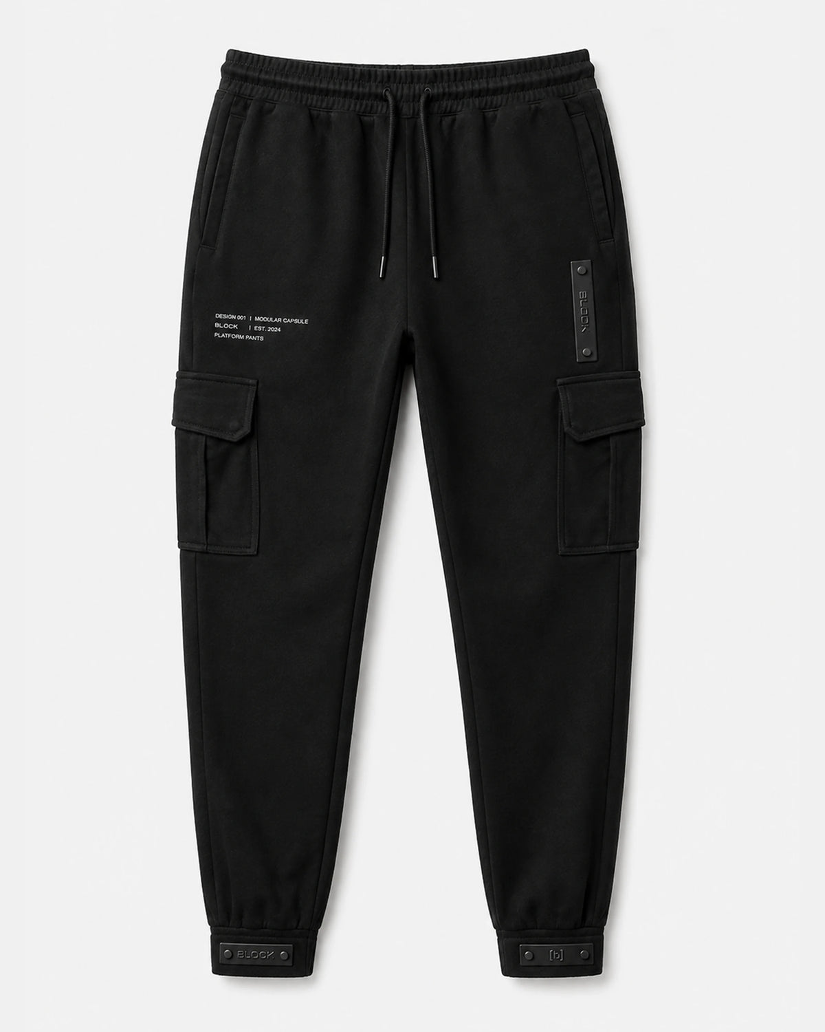 Black — Cargo Pant 01 — laid flat, bellowed thigh pockets, hip module, cuff tabs