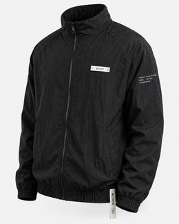 Black — Track Jacket 01 — cream chest module, cream sleeve notation
