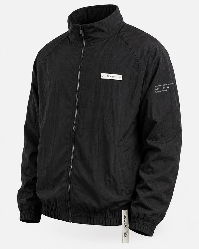 Black — Track Jacket 01 — cream chest module, cream sleeve notation